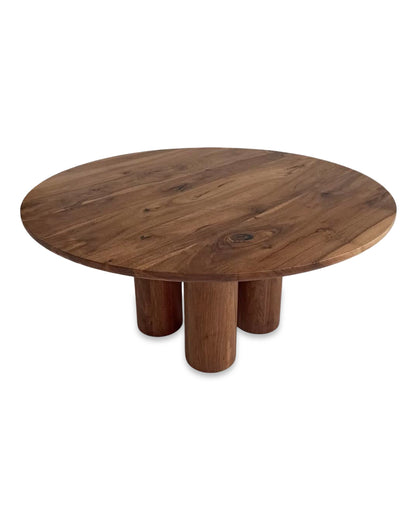 Ameline bespoke round dining table crafted from FSC certified solid walnut wood planks, featuring a minimalist designer style. This premium, sustainable piece by Talia Haus blends custom craftsmanship with luxury design, available in oak or walnut and extendable options for versatile dining spaces.