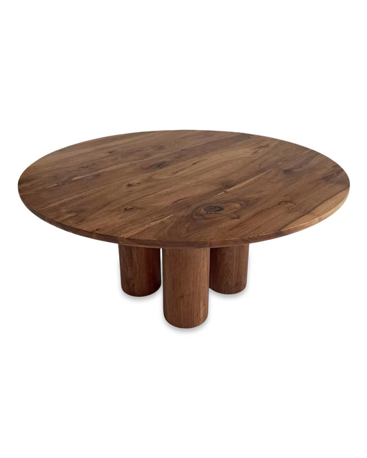 Ameline bespoke round dining table crafted from FSC certified solid walnut wood planks, featuring a minimalist designer style. This premium, sustainable piece by Talia Haus blends custom craftsmanship with luxury design, available in oak or walnut and extendable options for versatile dining spaces.