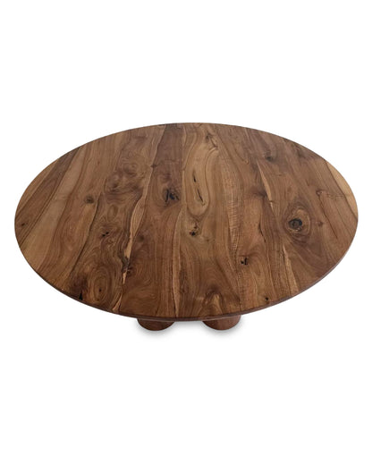 Ameline bespoke round dining table crafted from FSC certified solid walnut wood planks, featuring a minimalist designer style. This premium, sustainable piece by Talia Haus blends custom craftsmanship with luxury design, available in oak or walnut and extendable options for versatile dining spaces.