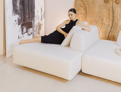 Deep-seated sectional sofa with minimalistic cushions – perfect for lounging.