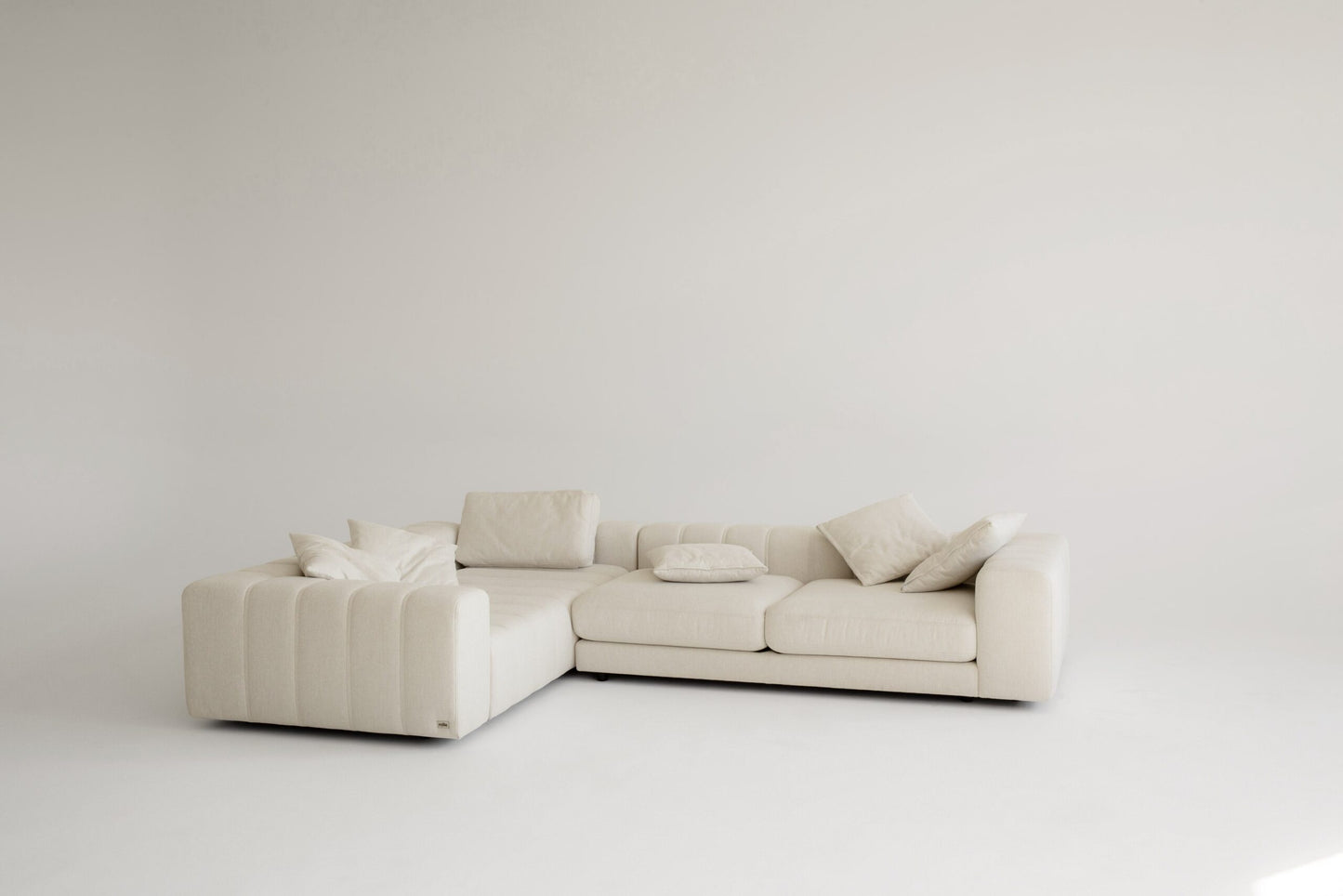 Custom beige sectional sofa on a white background
