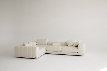 Custom beige sectional sofa on a white background