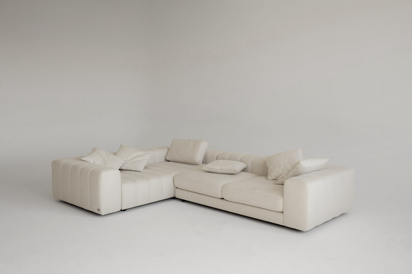 Luxury beige sectional sofa on a plain background