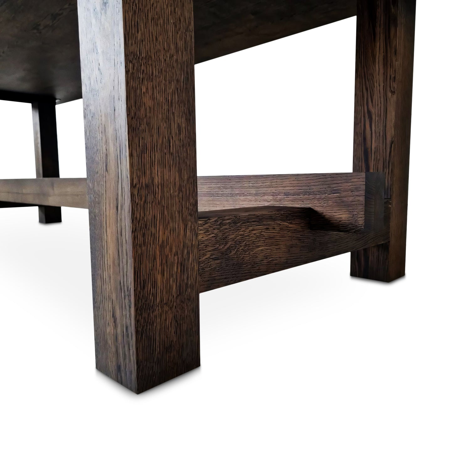 Detailed view of the Elsa rustic farmer-style dining table in rich chocolate oak, showcasing bespoke craftsmanship and FSC certified solid wood planks. This rectangular, extendable table by Talia Haus is a luxurious and sustainable piece, available in custom sizes and finishes including oak and walnut. A premium, handcrafted design perfect for elegant and timeless interiors.