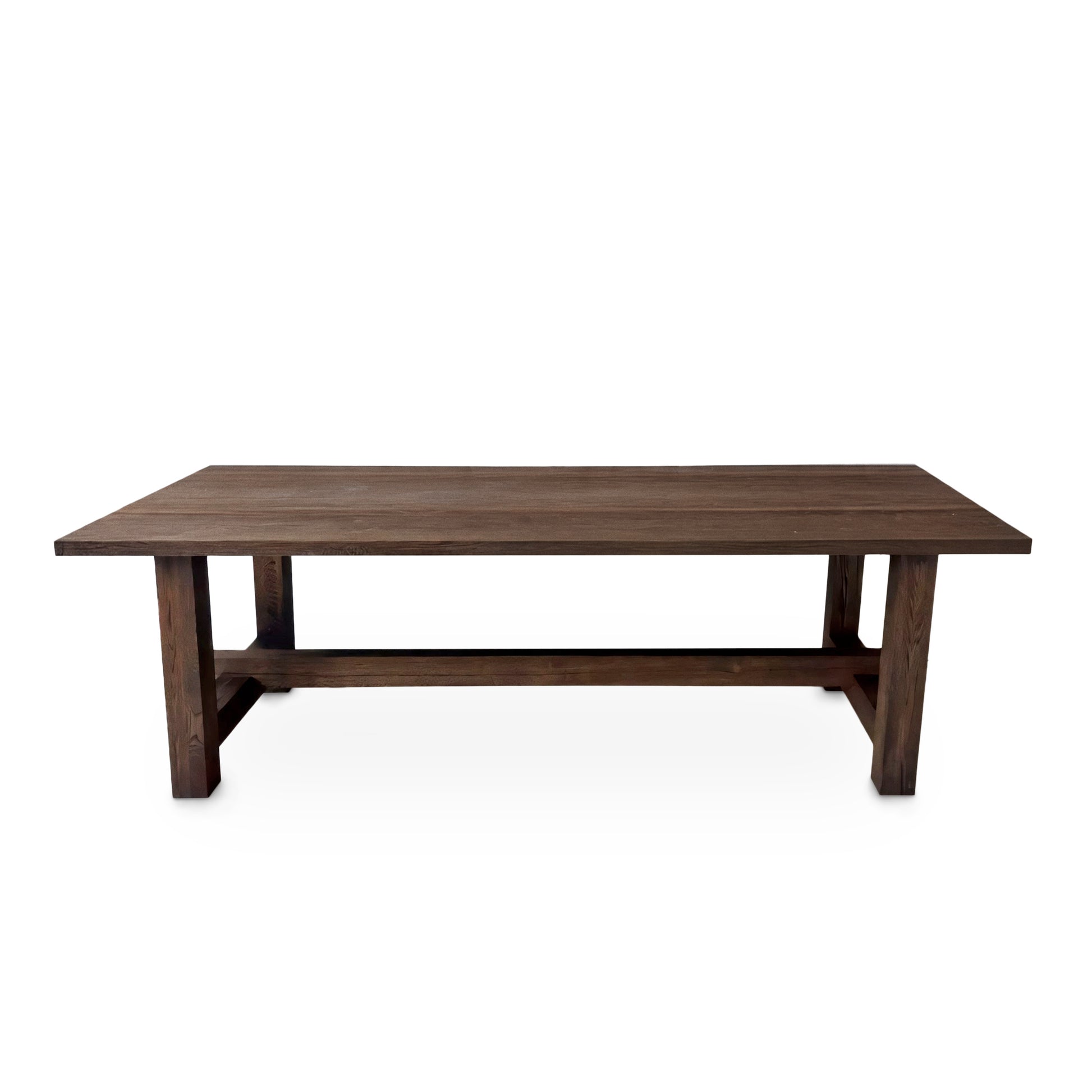 Detailed view of the Elsa rustic farmer-style dining table in rich chocolate oak, showcasing bespoke craftsmanship and FSC certified solid wood planks. This rectangular, extendable table by Talia Haus is a luxurious and sustainable piece, available in custom sizes and finishes including oak and walnut. A premium, handcrafted design perfect for elegant and timeless interiors.