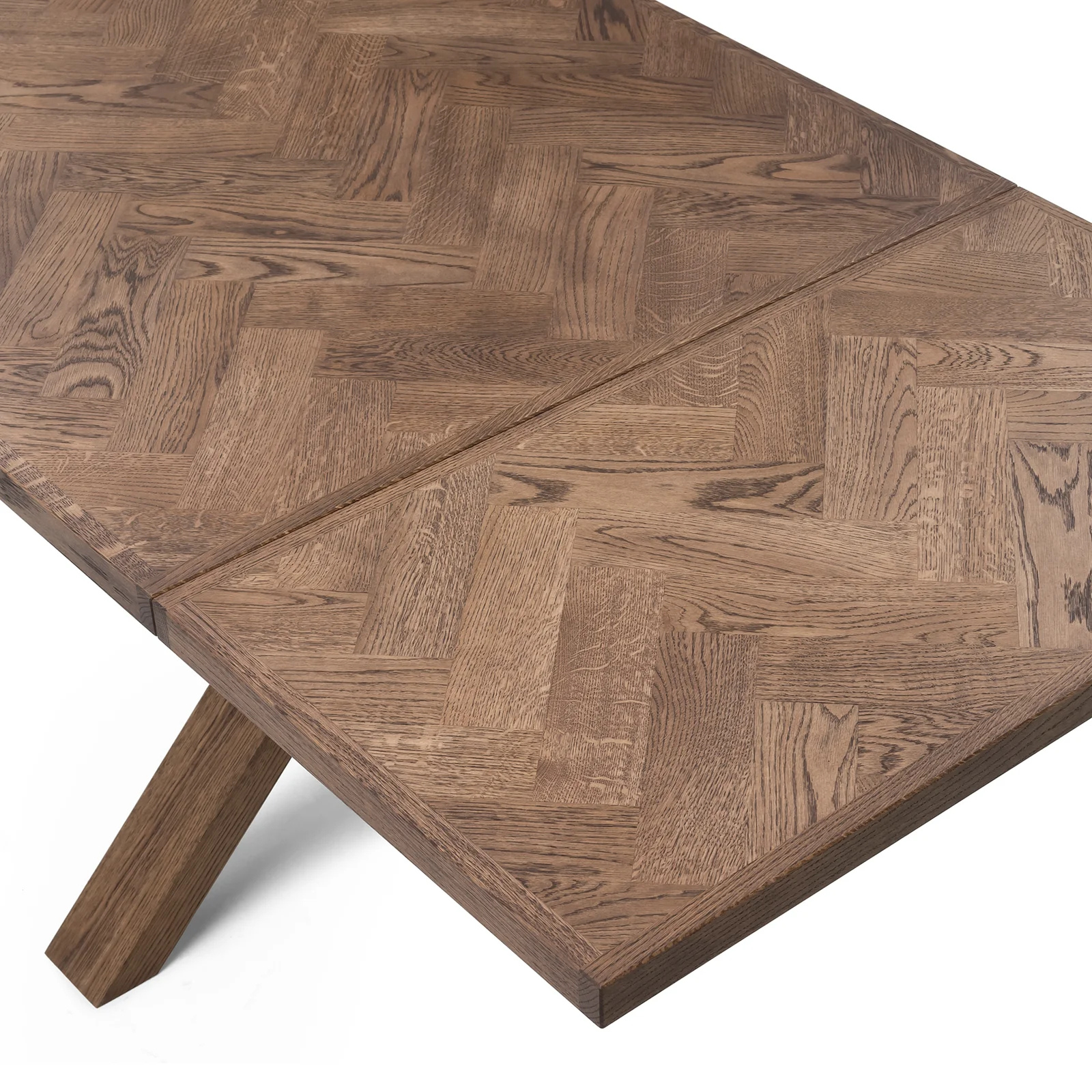 Gaia herringbone solid wood extendable dining table in chocolate oak with cross wood legs – luxury solid wood furniture piece.