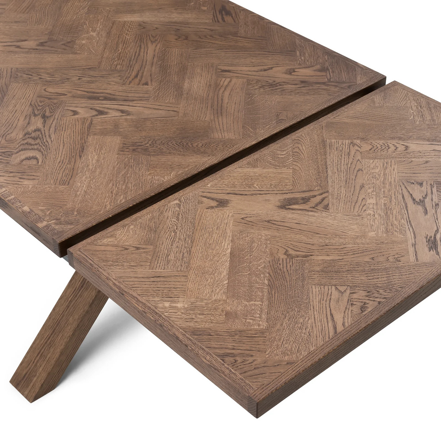 Gaia herringbone solid wood extendable dining table in chocolate oak with cross wood legs – luxury solid wood furniture piece.
