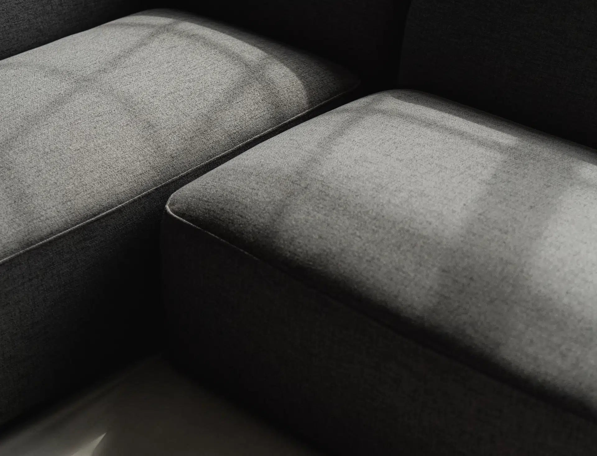 Close-up of a textured gray surface with a dark background