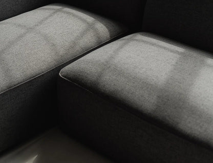 Close-up of a textured gray surface with a dark background