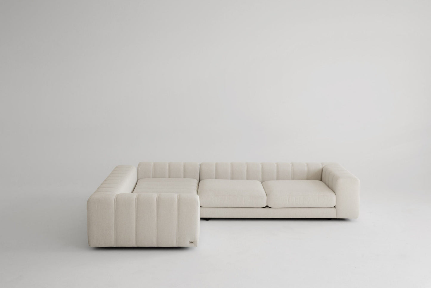 Beige memory foam sofa on a white background