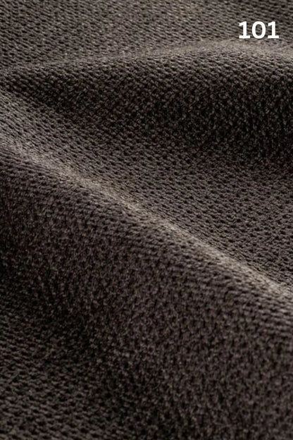 Close-up of black fabric texture with a slight wave pattern and number '101' in the corner. 