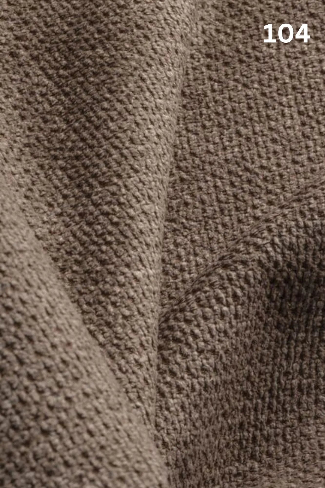 Close-up of beige fabric texture with a slight wave pattern and number '104' in the corner. 