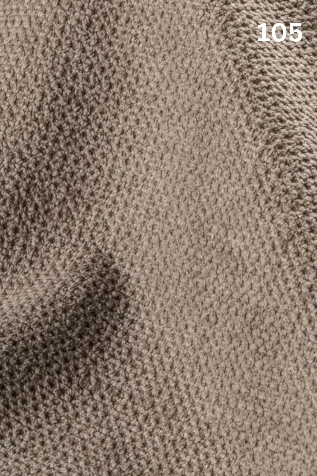 Close-up of beige fabric texture with a slight wave pattern and number '105' in the corner. 