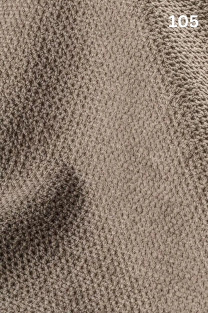 Close-up of beige fabric texture with a slight wave pattern and number '105' in the corner. 