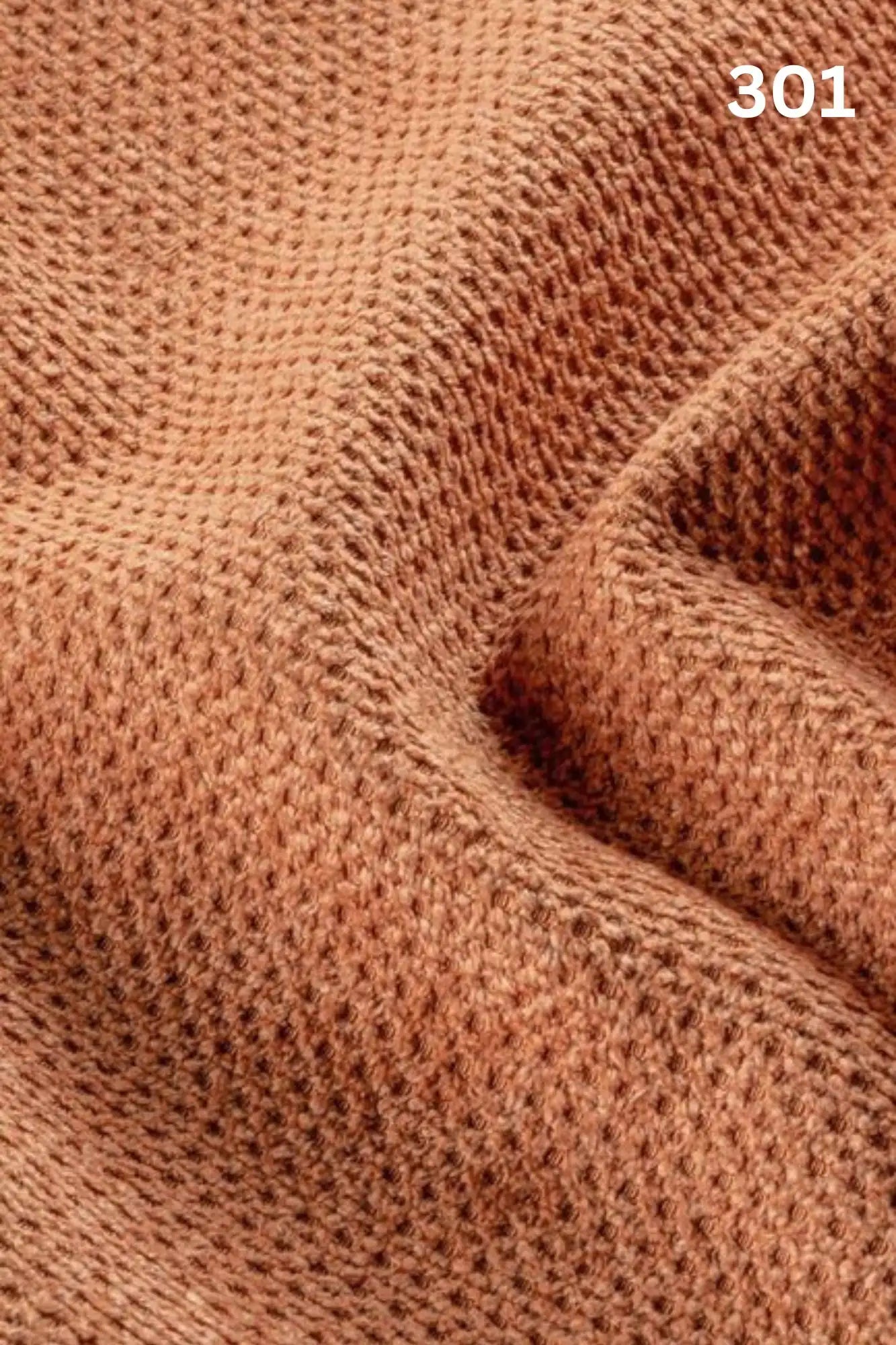 Close-up of orange fabric texture with a slight wave pattern and number '301' in the corner. 