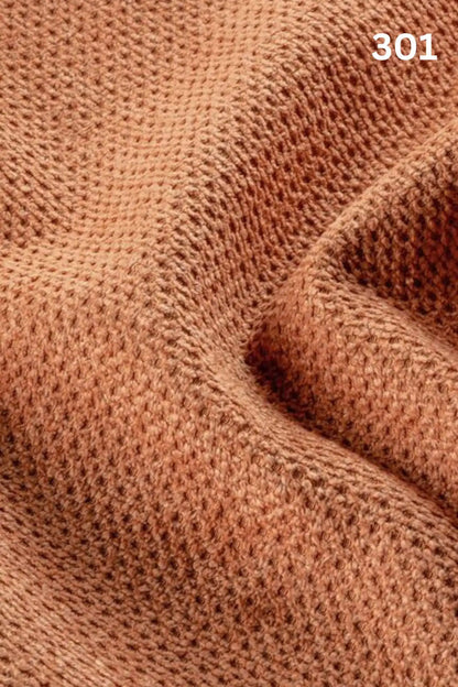 Close-up of orange fabric texture with a slight wave pattern and number '301' in the corner. 