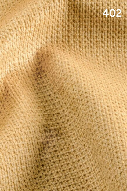 Close-up of yellow fabric texture with a slight wave pattern and number '402' in the corner. 