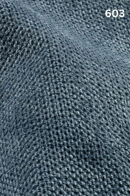 Close-up of blue fabric texture with a slight wave pattern and number '603' in the corner. 