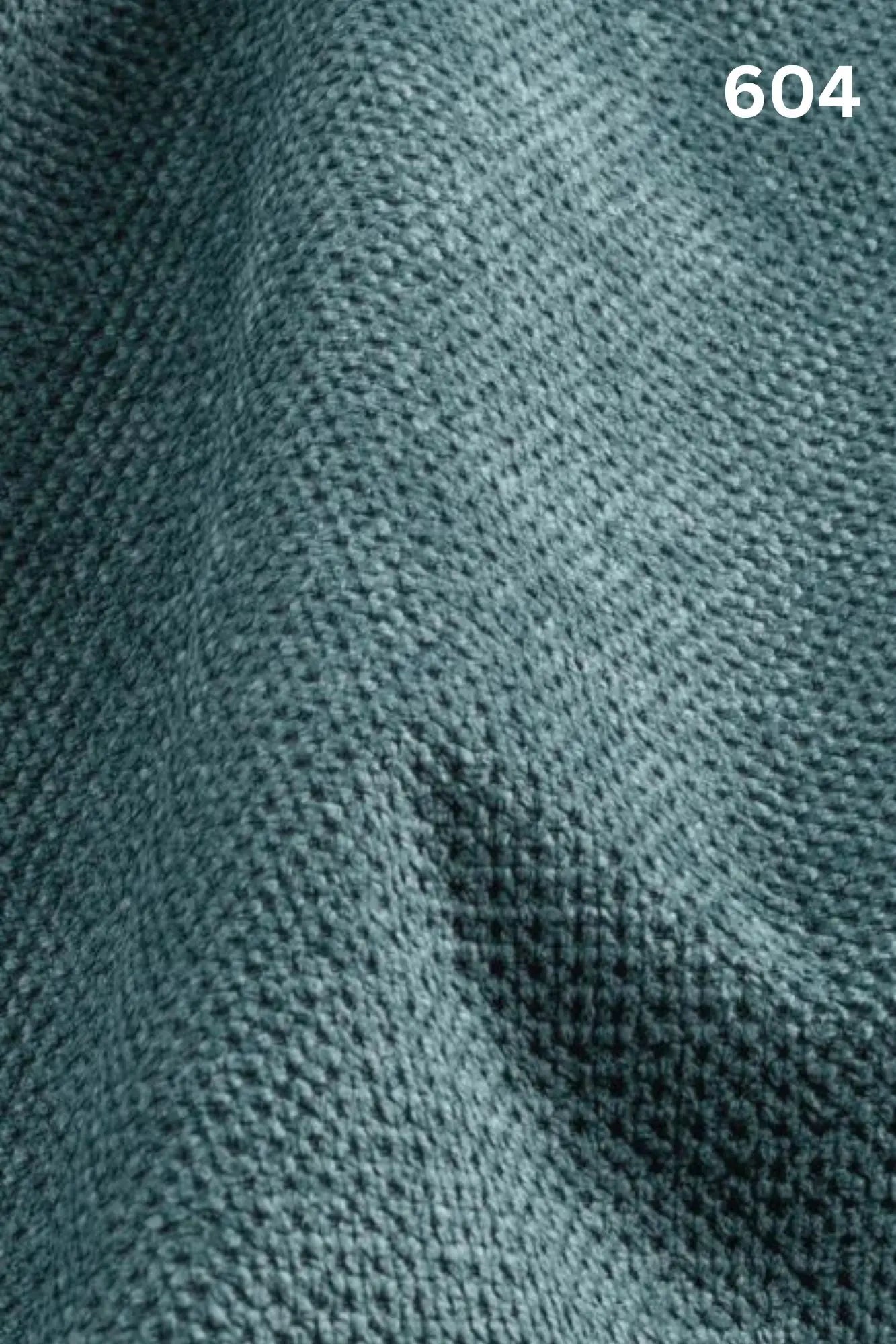 Close-up of blue fabric texture with a slight wave pattern and number '604' in the corner. 