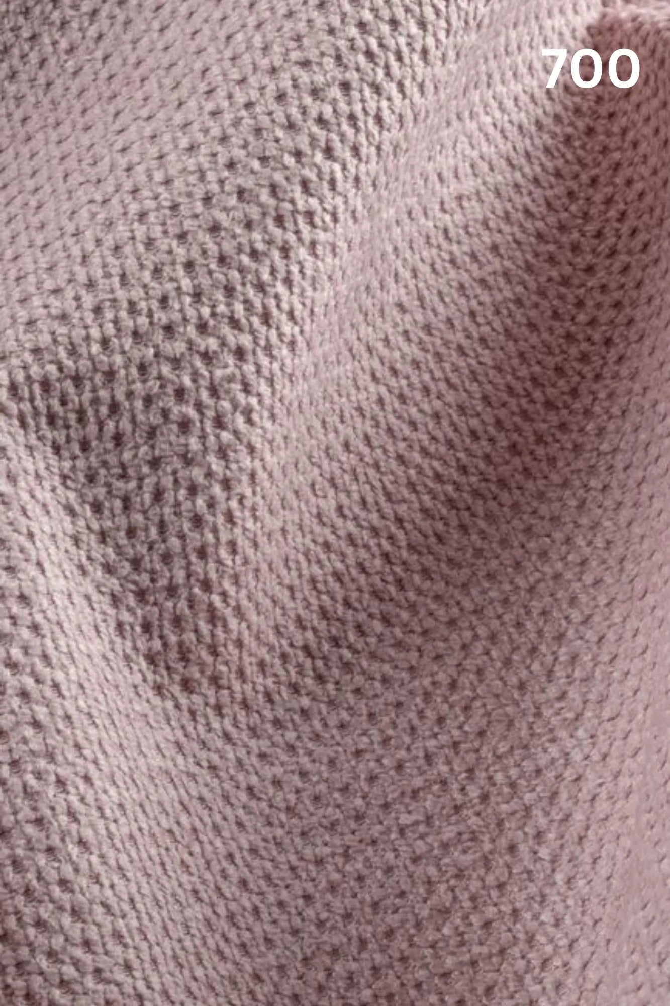 Close-up of pink fabric texture with a slight wave pattern and number '700' in the corner. 