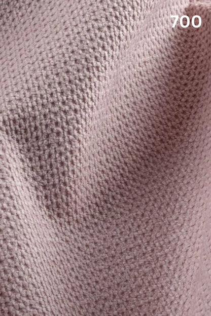 Close-up of pink fabric texture with a slight wave pattern and number '700' in the corner. 