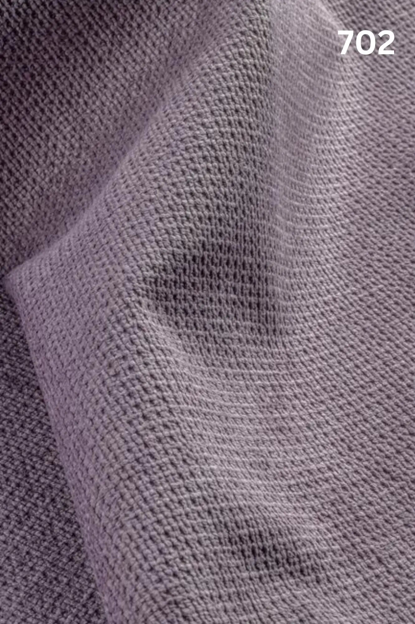Close-up of velvet fabric texture with a slight wave pattern and number '702' in the corner. 