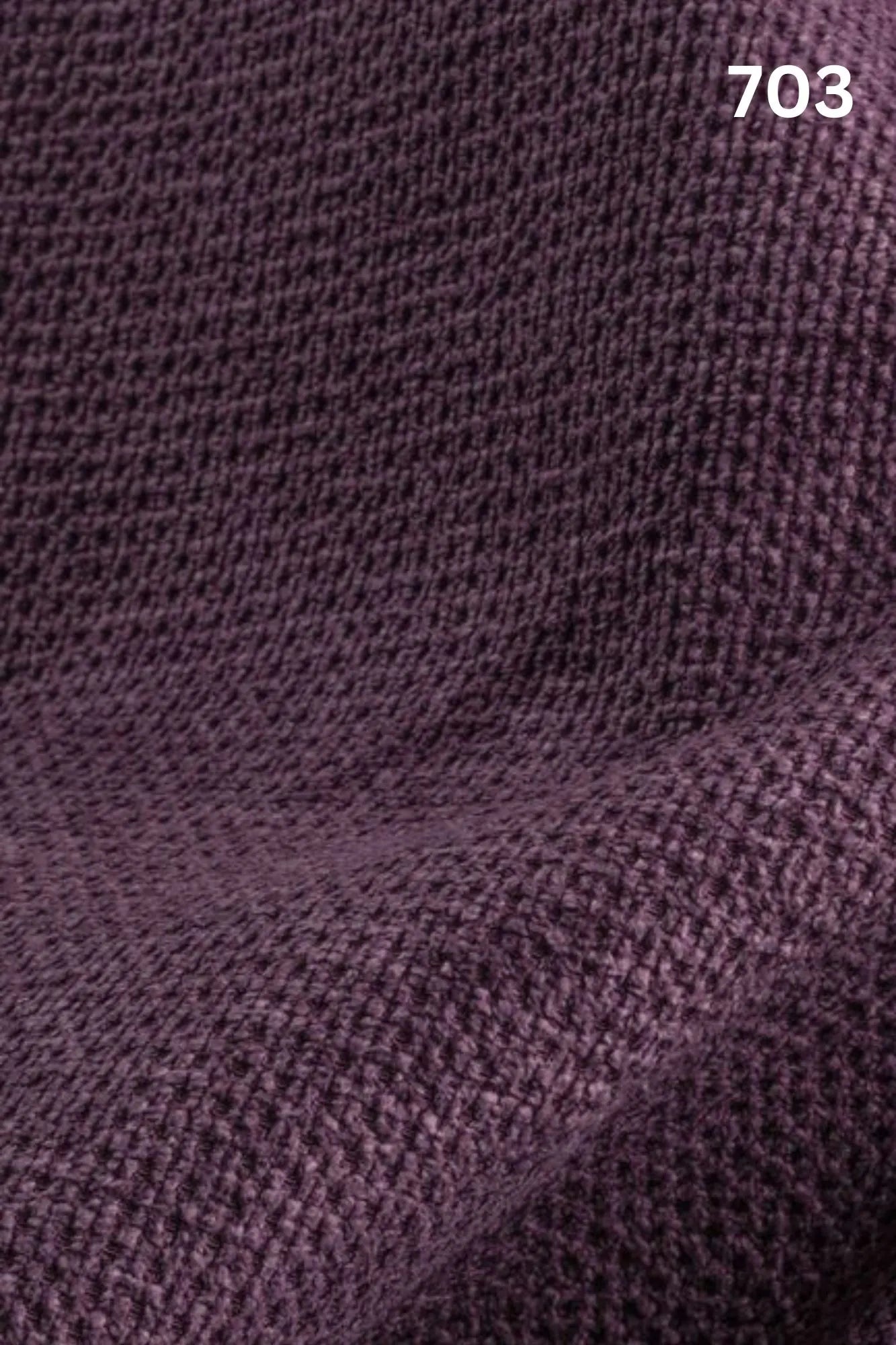 Close-up of velvet fabric texture with a slight wave pattern and number '703' in the corner. 