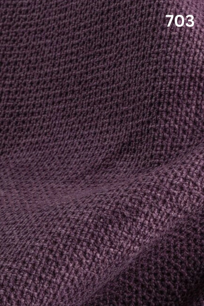 Close-up of velvet fabric texture with a slight wave pattern and number '703' in the corner. 