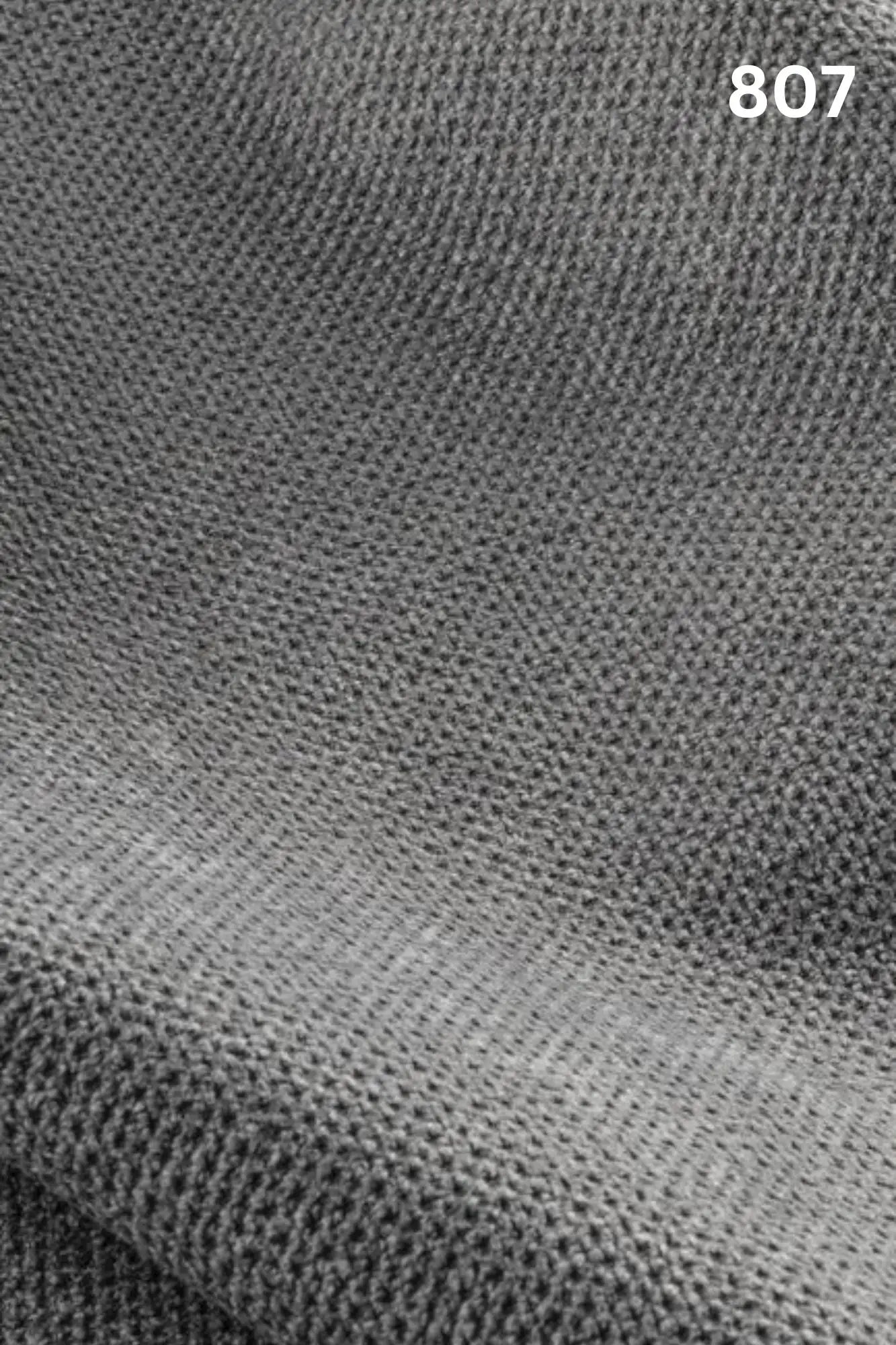 Close-up of gray fabric texture with a slight wave pattern and number '807' in the corner. 