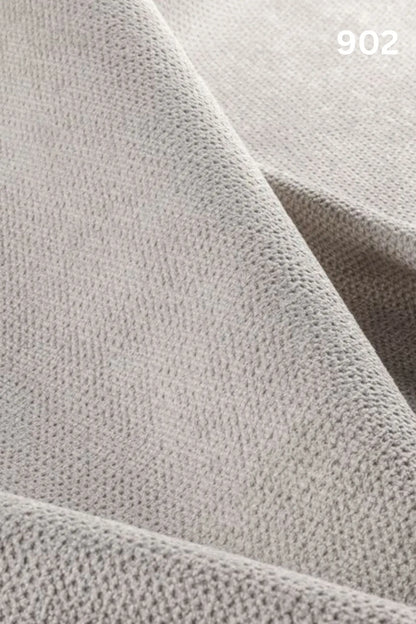 Close-up of white fabric texture with a slight wave pattern and number '902' in the corner. 