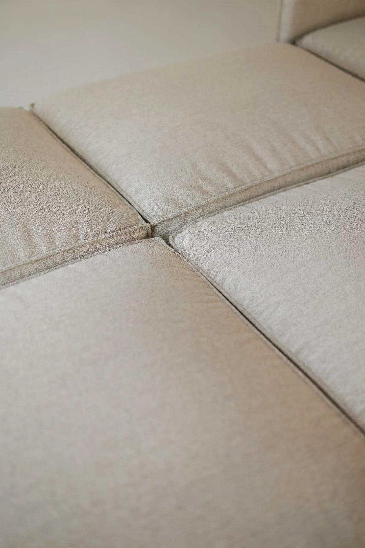 Close-up of beige fabric for a modular sofa bed 