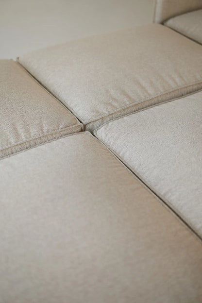 Close-up of beige fabric for a modular sofa bed 
