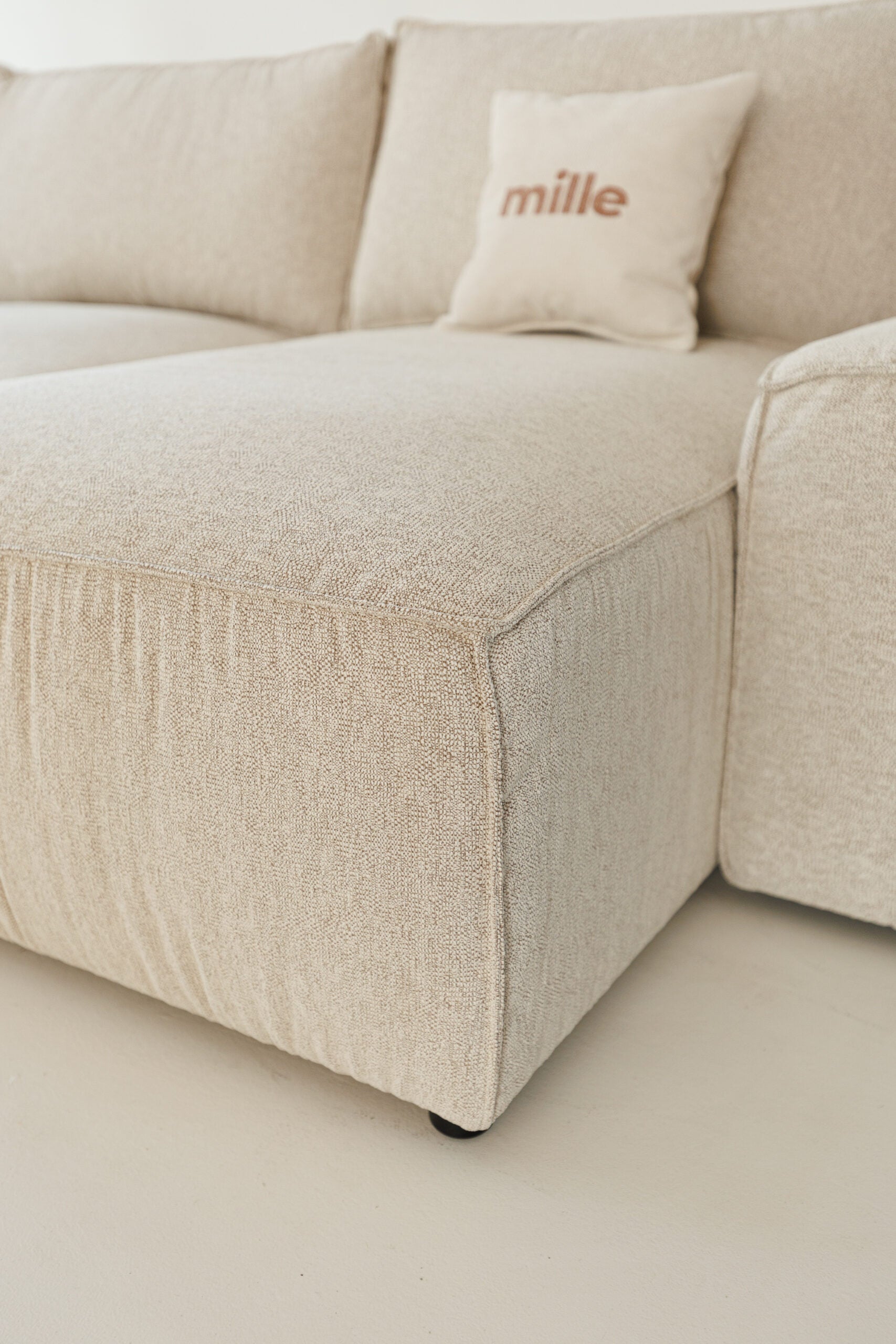 Milano modular sofa in premium Belgian fabric, corner view – extendable bespoke sofa with built-in storage, low-profile modern design, upholstered in premium durable fabric, featuring polyurethane and memory foam seat cushions with plywood frame. Stylish and functional seating and sleeping solution for contemporary interiors.