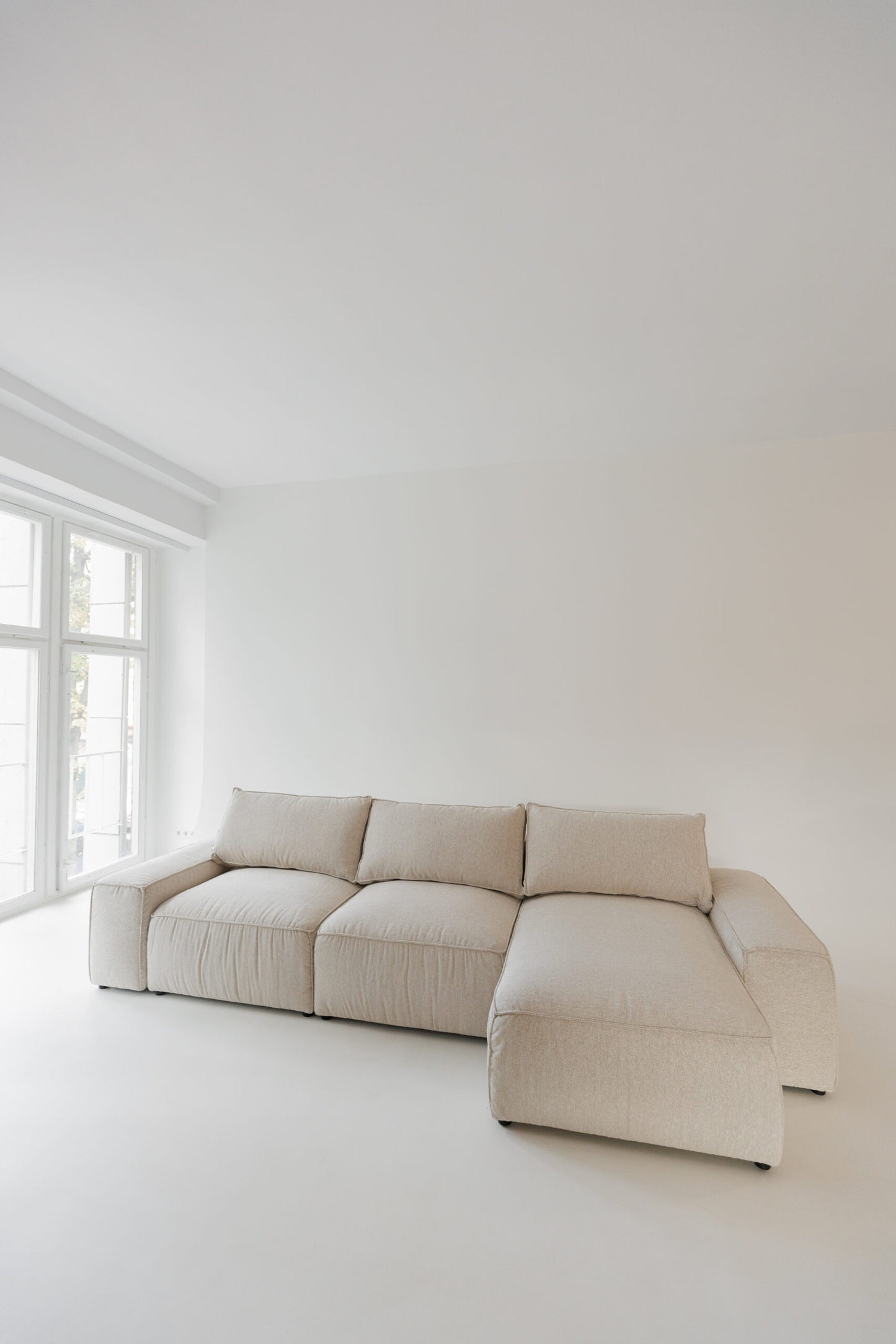 Milano modular sofa in Atlas 901 fabric, corner view – extendable bespoke sofa with built-in storage, low-profile modern design, upholstered in premium durable fabric, featuring polyurethane and memory foam seat cushions with plywood frame. Stylish and functional seating and sleeping solution for contemporary interiors.