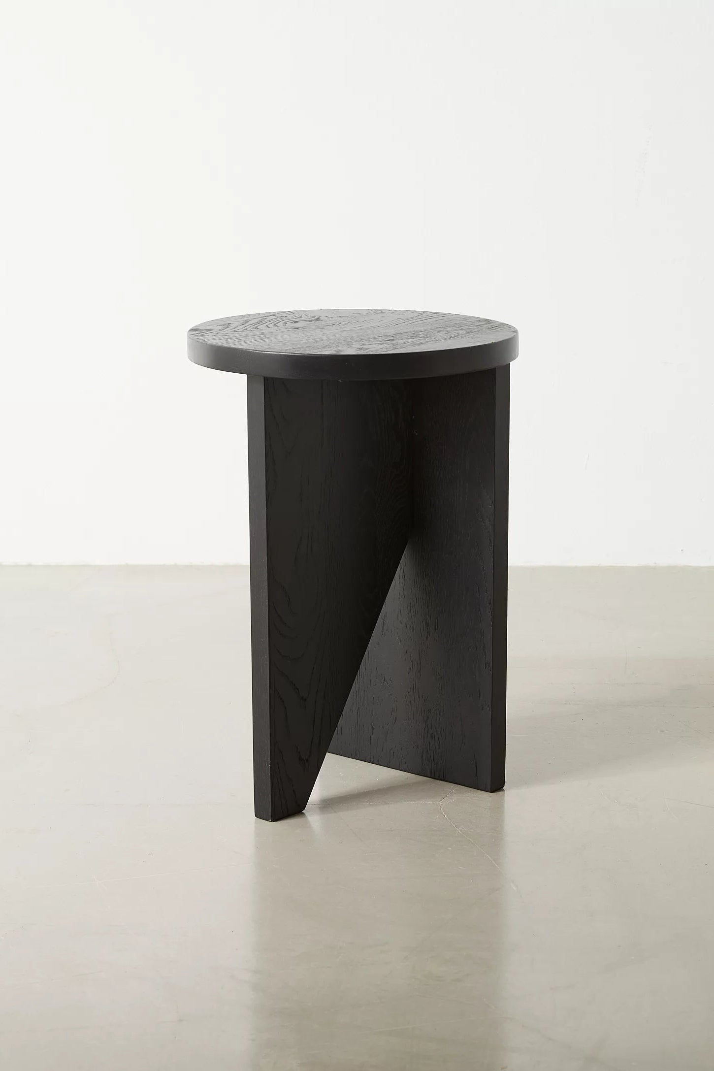 Moore solid wood side table with asymmetric design, handcrafted from FSC-certified oak or walnut. This versatile and timeless piece functions as both a coffee table and side table, offering bespoke, sustainable style for modern and compact living spaces.