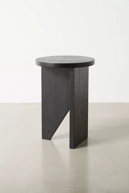 Moore solid wood side table with asymmetric design, handcrafted from FSC-certified oak or walnut. This versatile and timeless piece functions as both a coffee table and side table, offering bespoke, sustainable style for modern and compact living spaces.