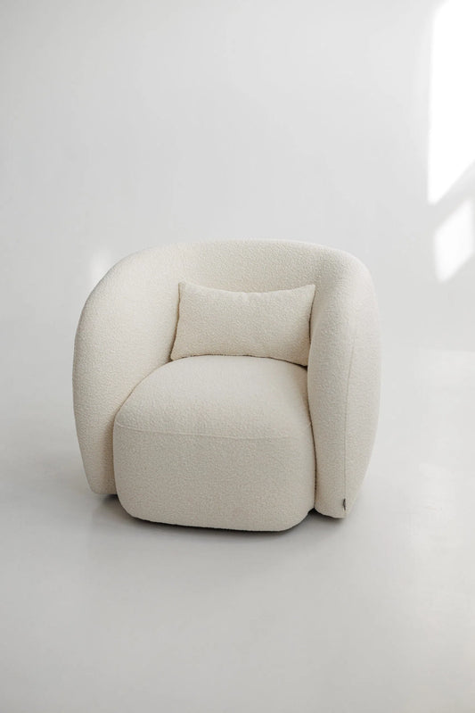 White boucle armchair on a white background