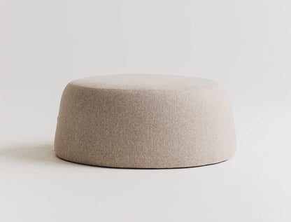 Beige ottoman on a light gray background