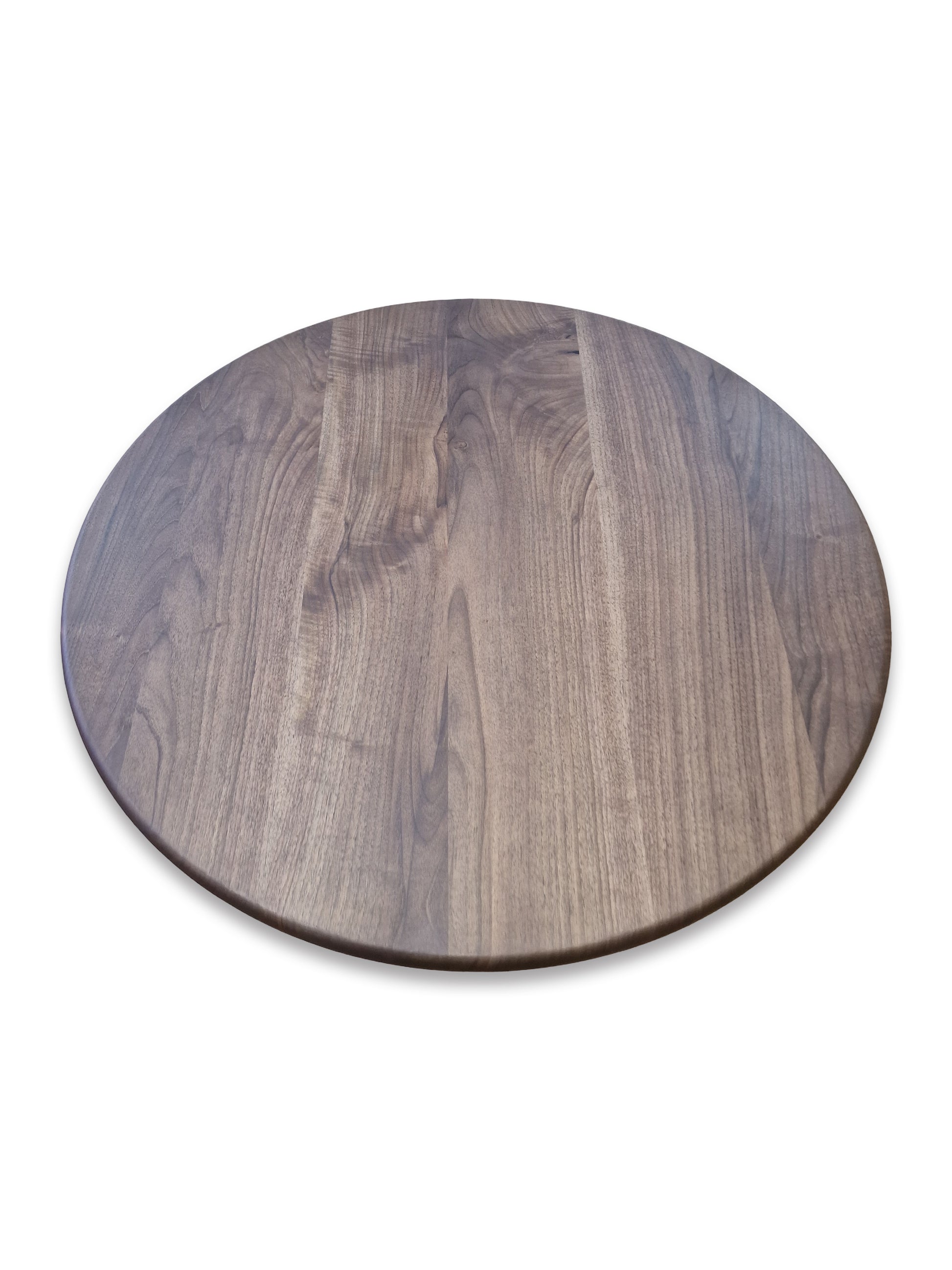 Ameline bespoke round dining table crafted from FSC certified solid walnut wood planks, featuring a minimalist designer style. This premium, sustainable piece by Talia Haus blends custom craftsmanship with luxury design, available in oak or walnut and extendable options for versatile dining spaces.