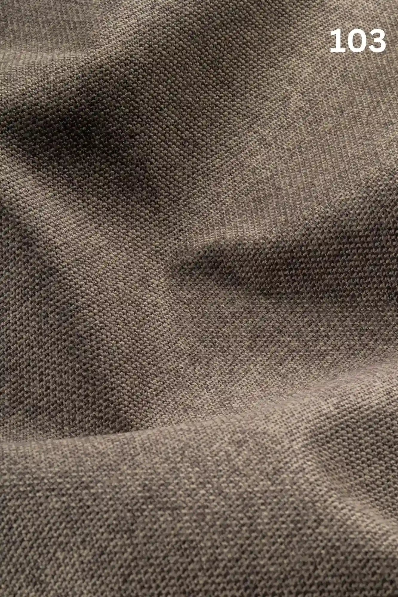 Close-up of gray brown woven textured fabric for sofas with number '103' in the corner. 