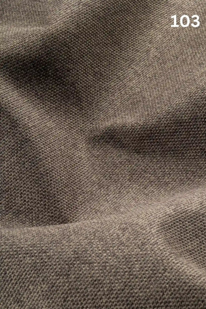 Close-up of gray brown woven textured fabric for sofas with number '103' in the corner. 