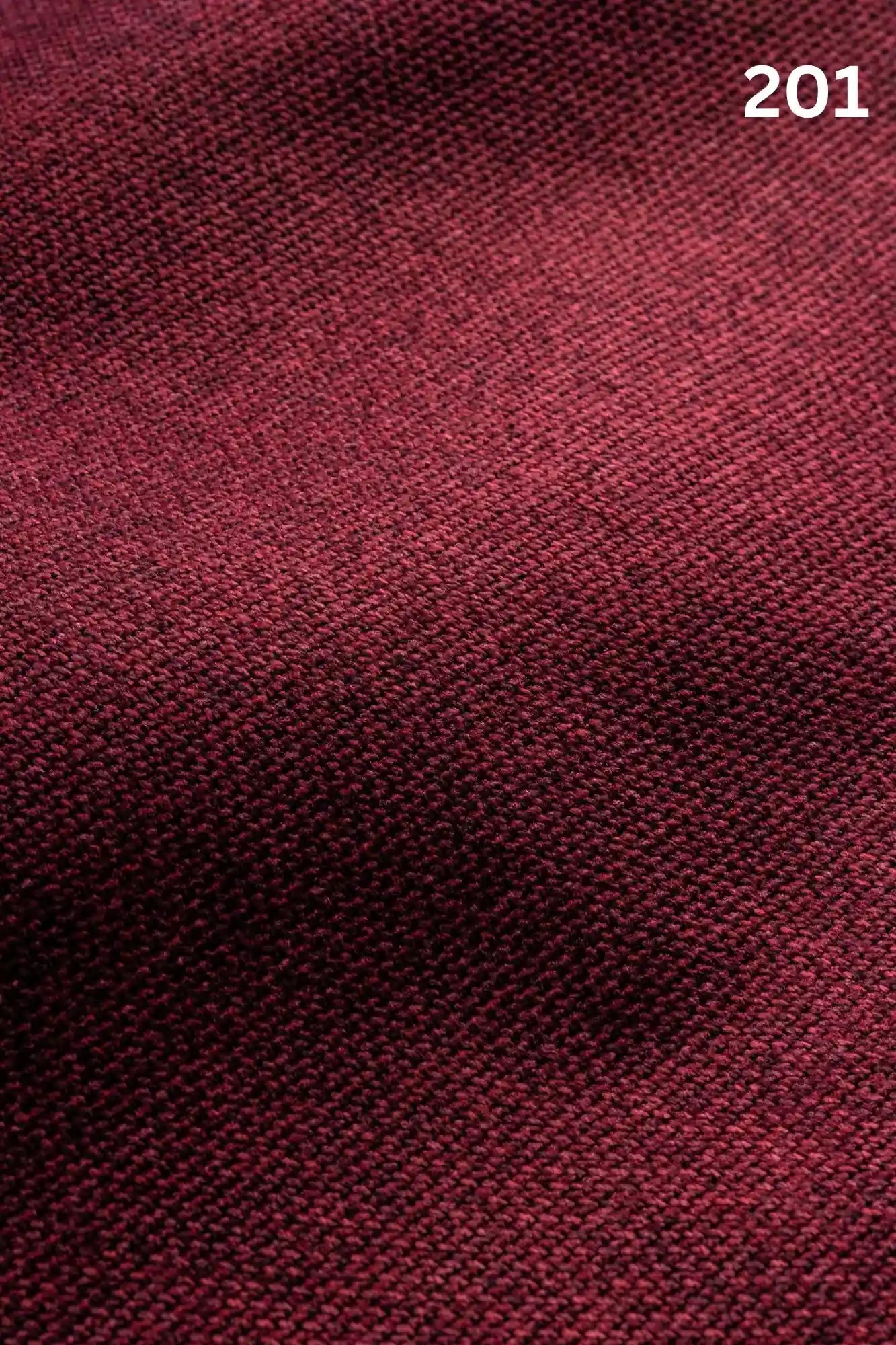 Close-up of red woven textured fabric for sofas with number '201' in the corner. 