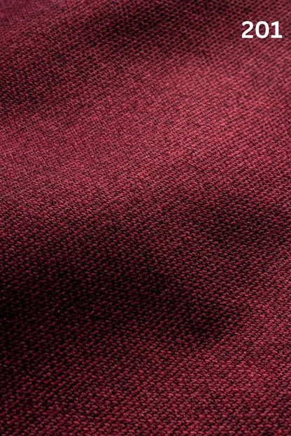 Close-up of red woven textured fabric for sofas with number '201' in the corner. 