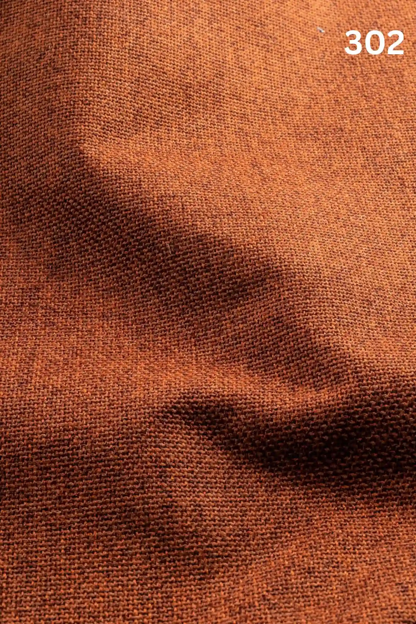 Close-up of orange woven textured fabric for sofas with number '302' in the corner. 
