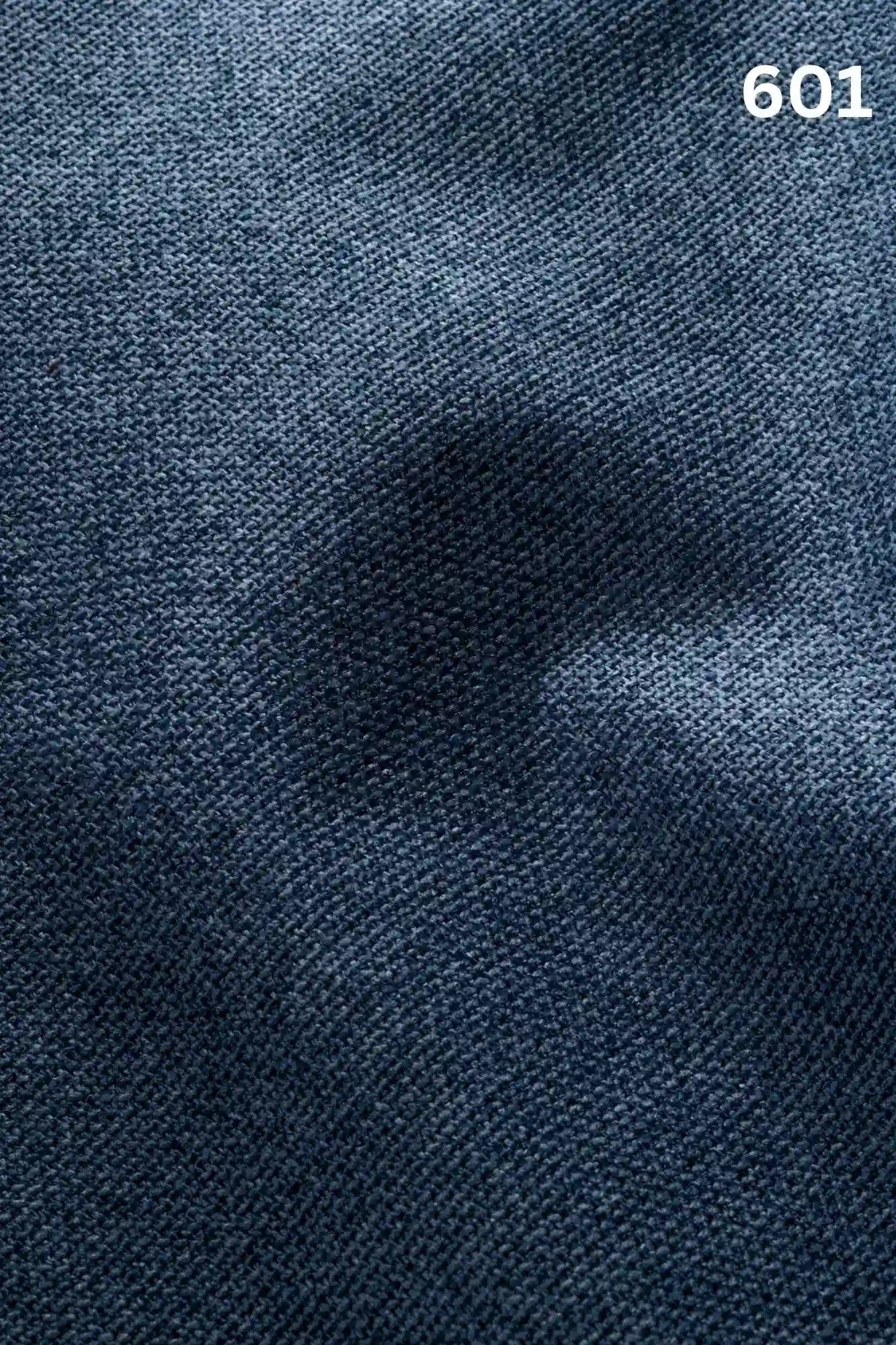 Close-up of blue woven textured fabric for sofas with number '601' in the corner. 