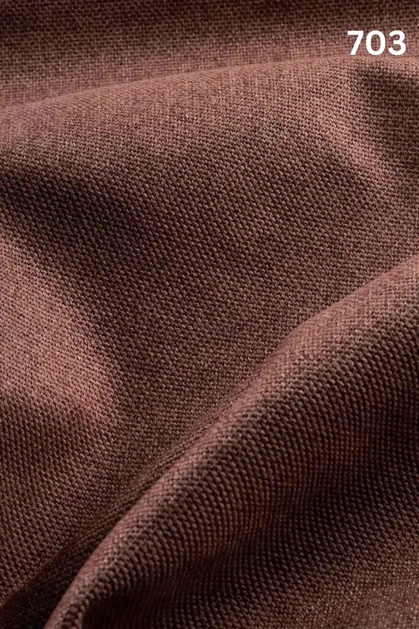 Close-up of copper colored woven textured fabric for sofas with number '703' in the corner. 