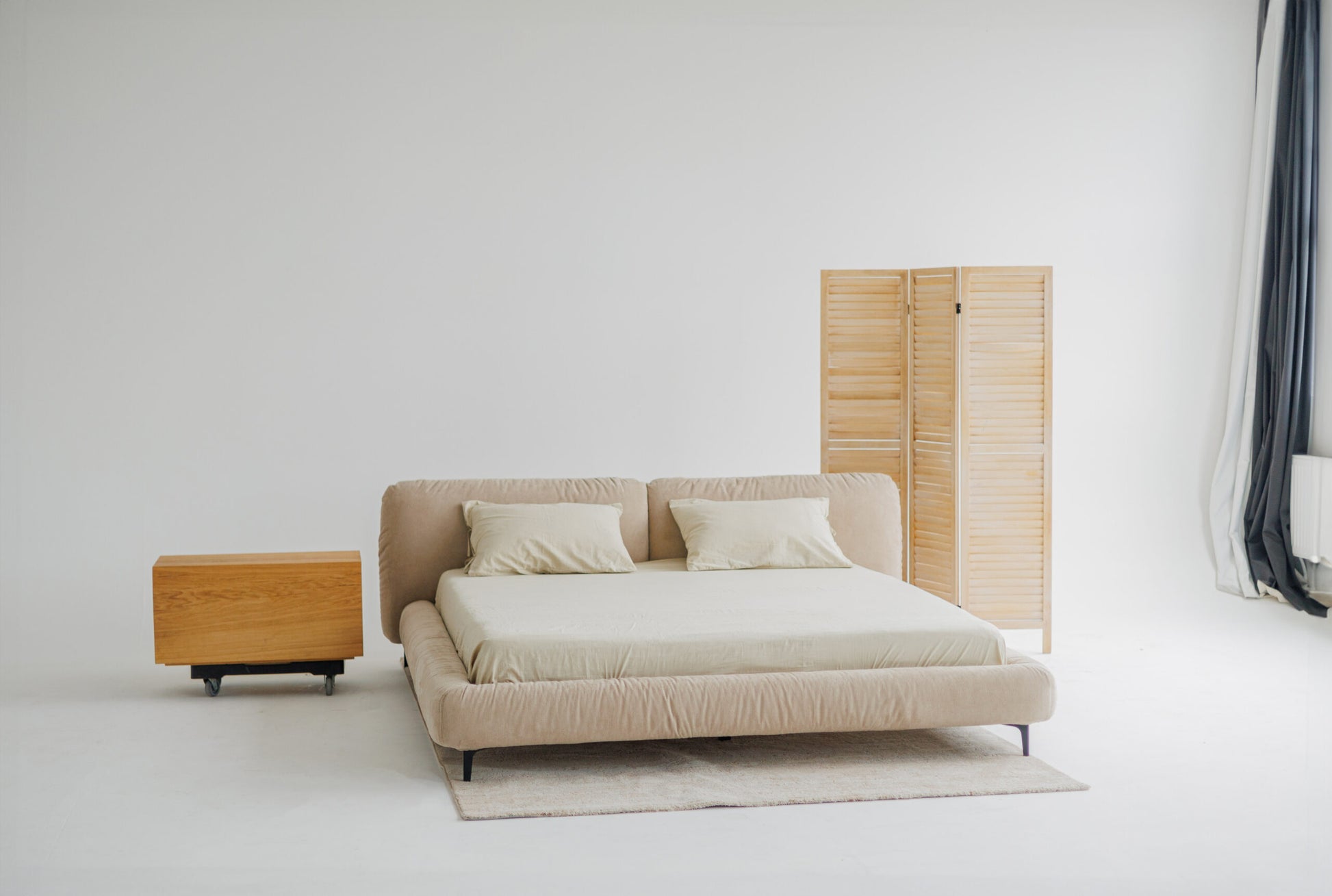 TESA bed upholstered in premium beige fabric, custom bespoke designer luxury, showcased in a photoshoot by Talia Haus.
