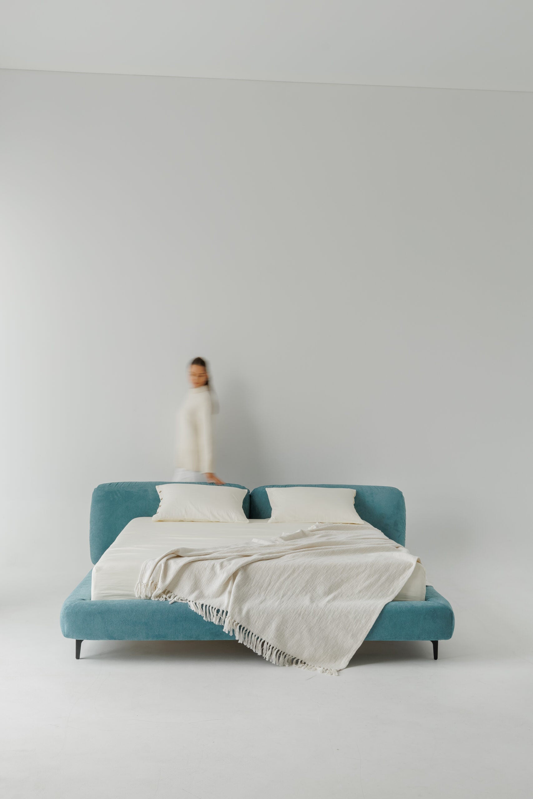 TESA bed upholstered in premium blue fabric, custom bespoke designer luxury, showcased in a photoshoot by Talia Haus.
