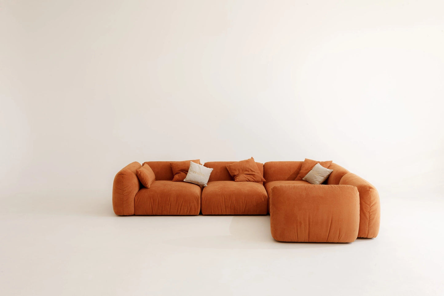 Orange corner sofa on a white background