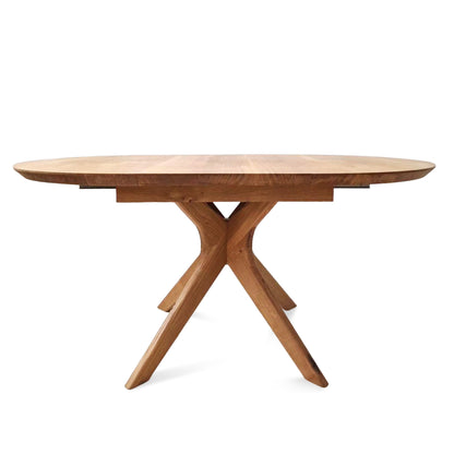 Vera extendable round dining table in clear oak with solid wood spider legs, natural finish, middle extension, 3cm thick top, handcrafted from FSC-certified solid oak, customizable size, color, and edge.